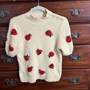 Maeve Cream Sweater with Red Ladybugs